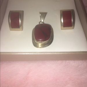 Sliver set of earrings and pendant